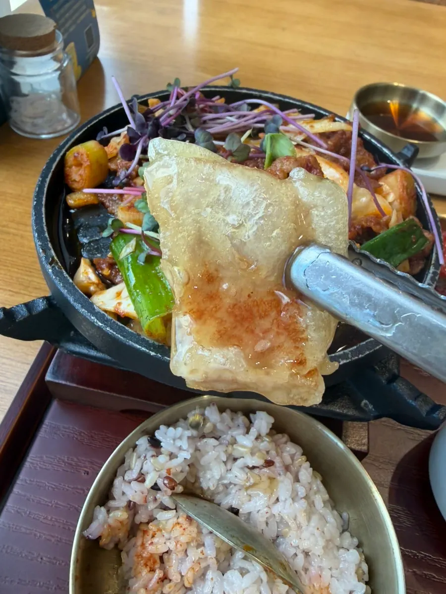 Mini sweet and sour pork dipped in sauce