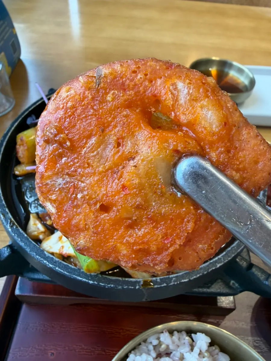 Bite-size kimchijeon dipped in sauce