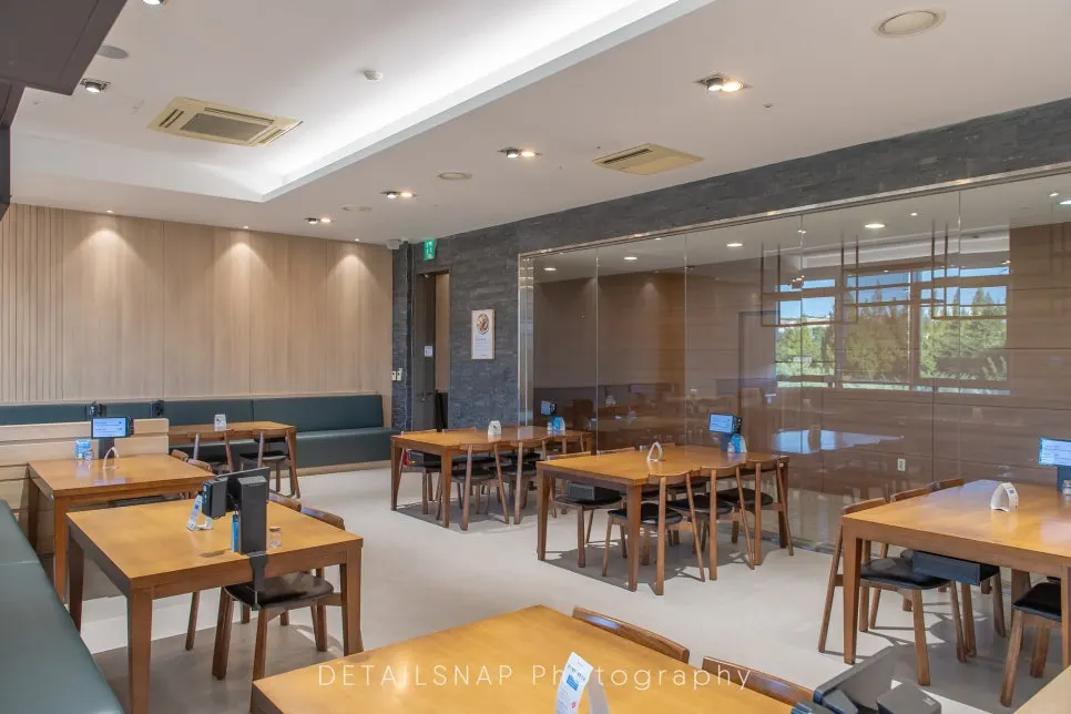 Interior of Cafe Dongi with wood furniture and orange lighting