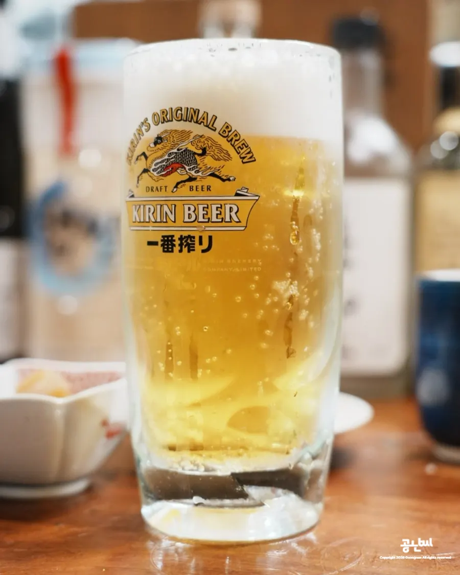 Two glasses of Kirin draft beer served first