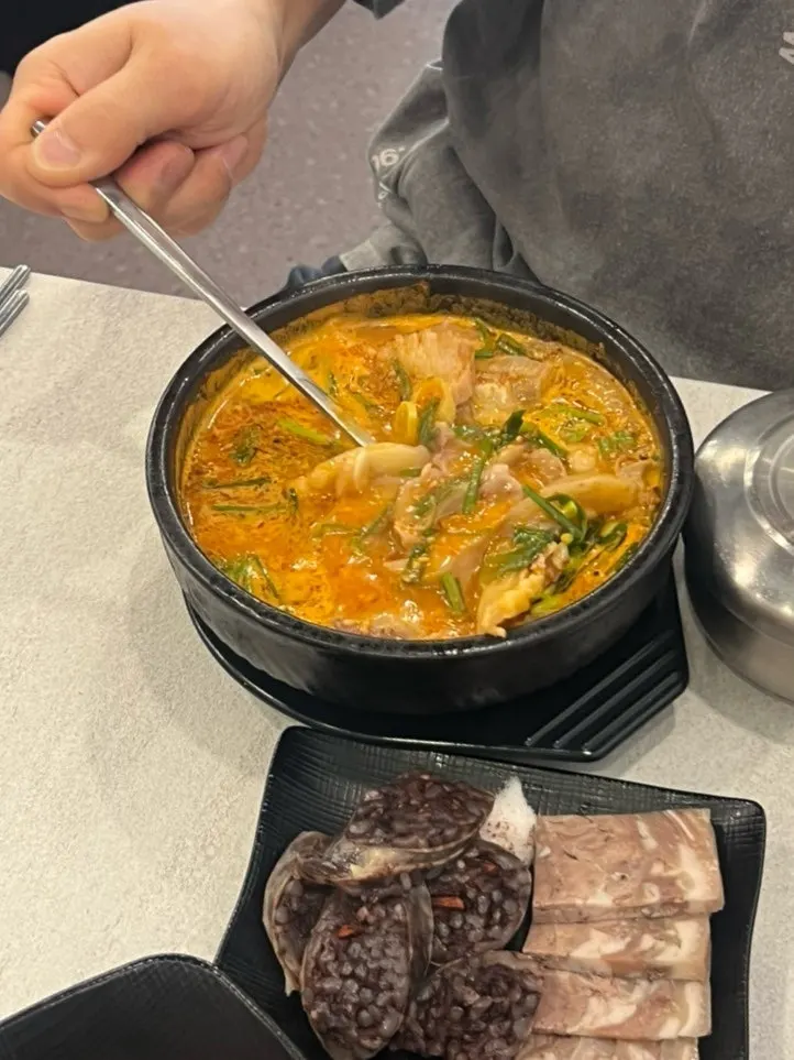 Close-up of a bowl of spicy pork gukbap