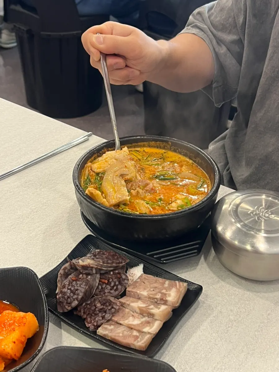 Spicy pork gukbap broth loaded with meat