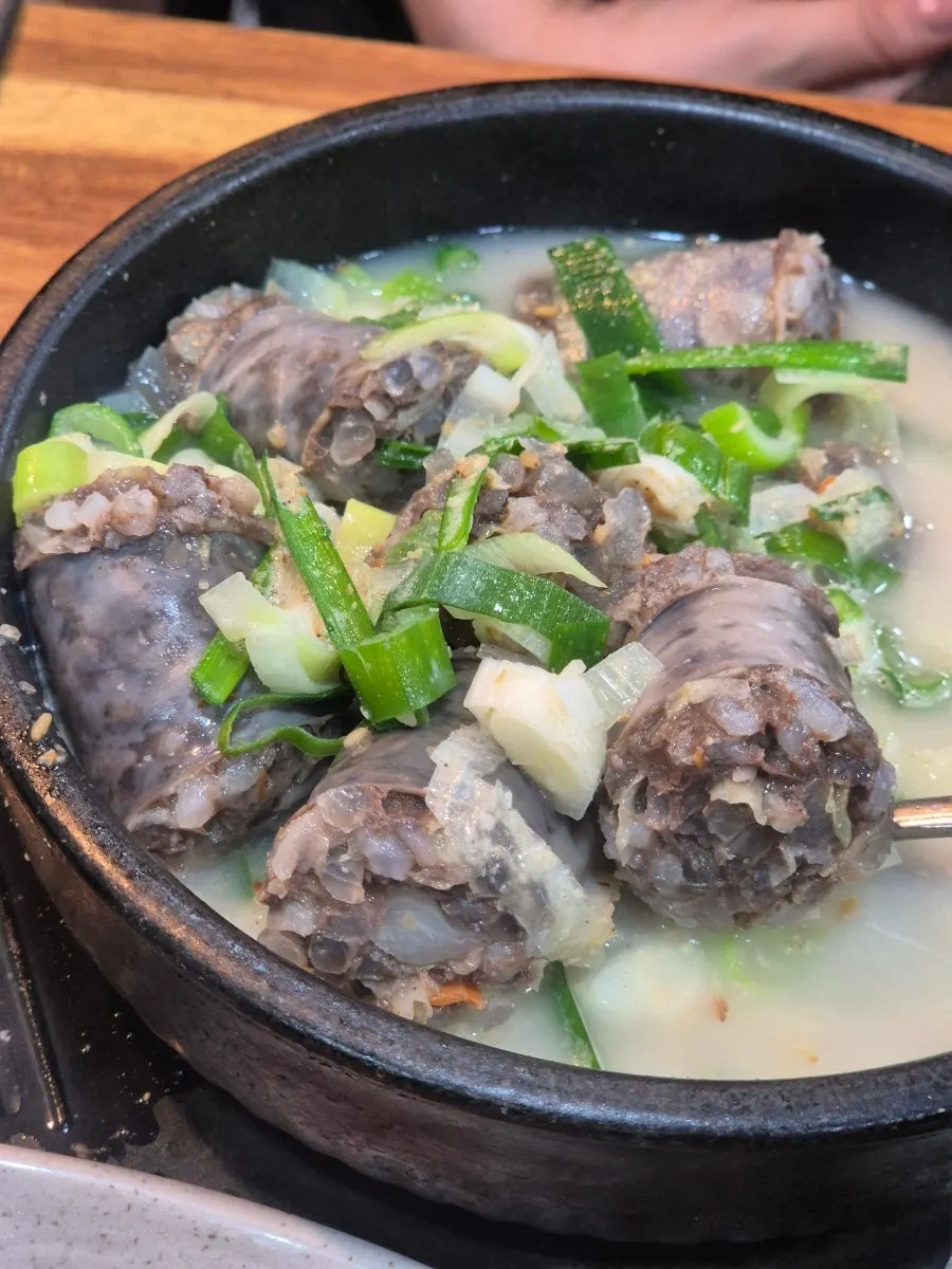 A spoonful of sundaeguk ingredients scooped up