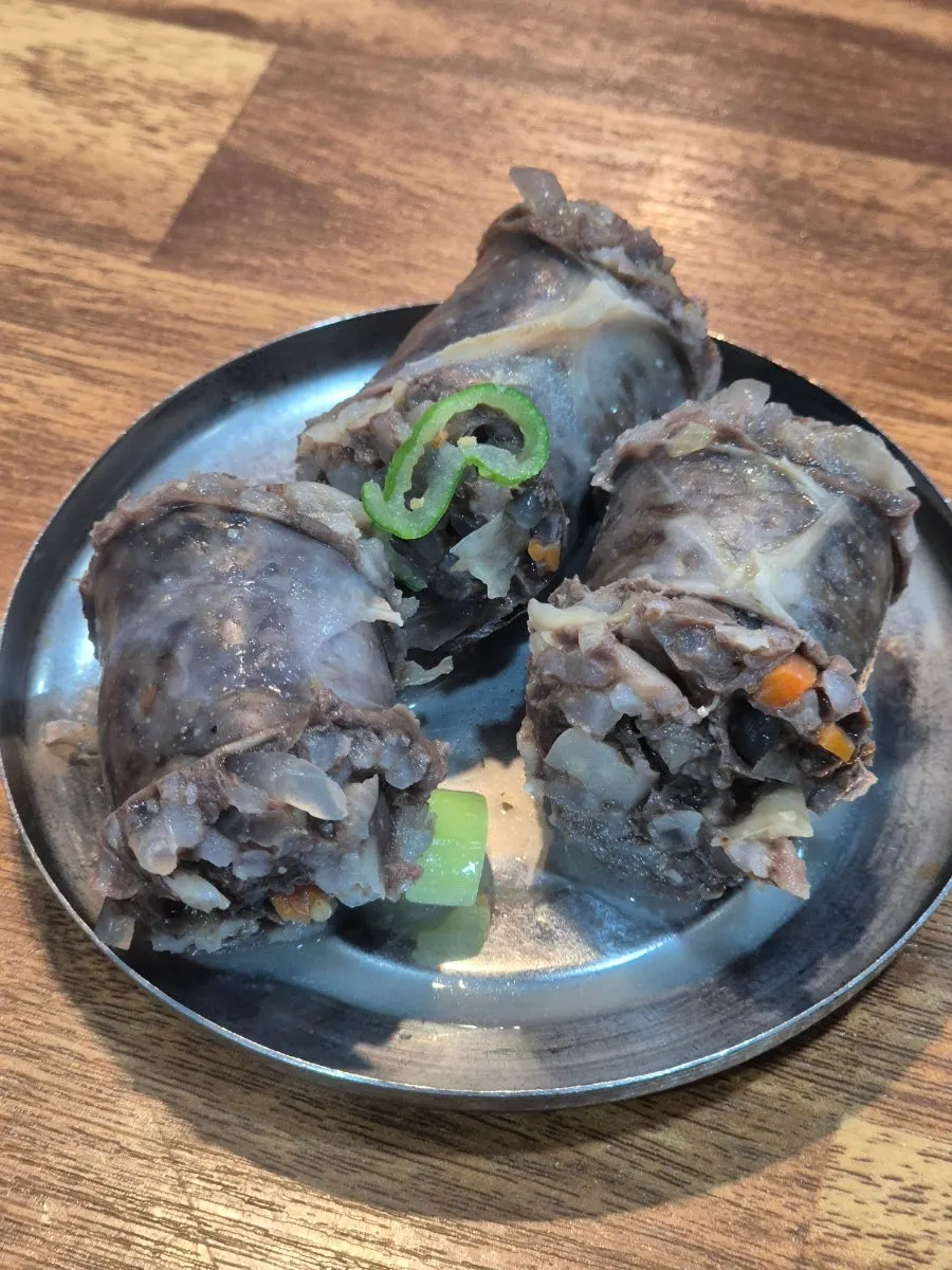Native sausage set aside on the rice bowl lid