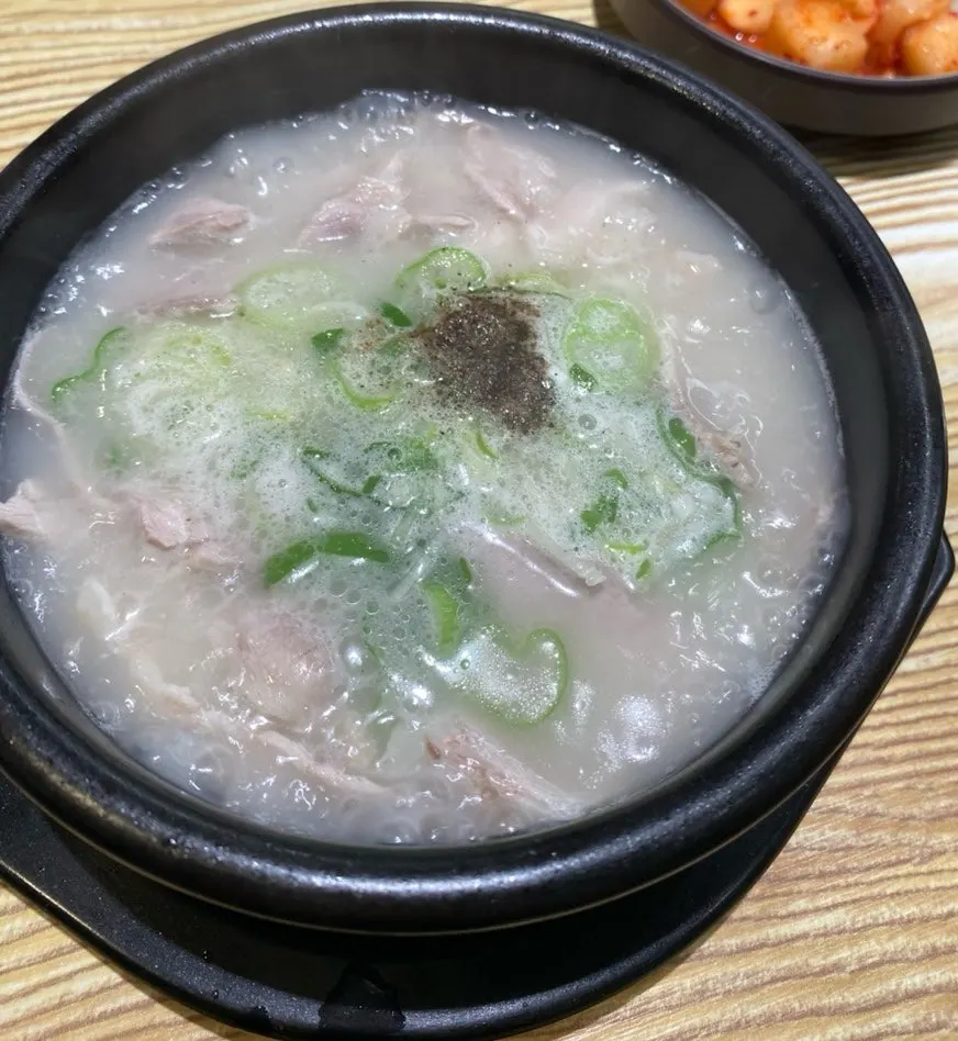 A bowl of pork soup with milky-white broth