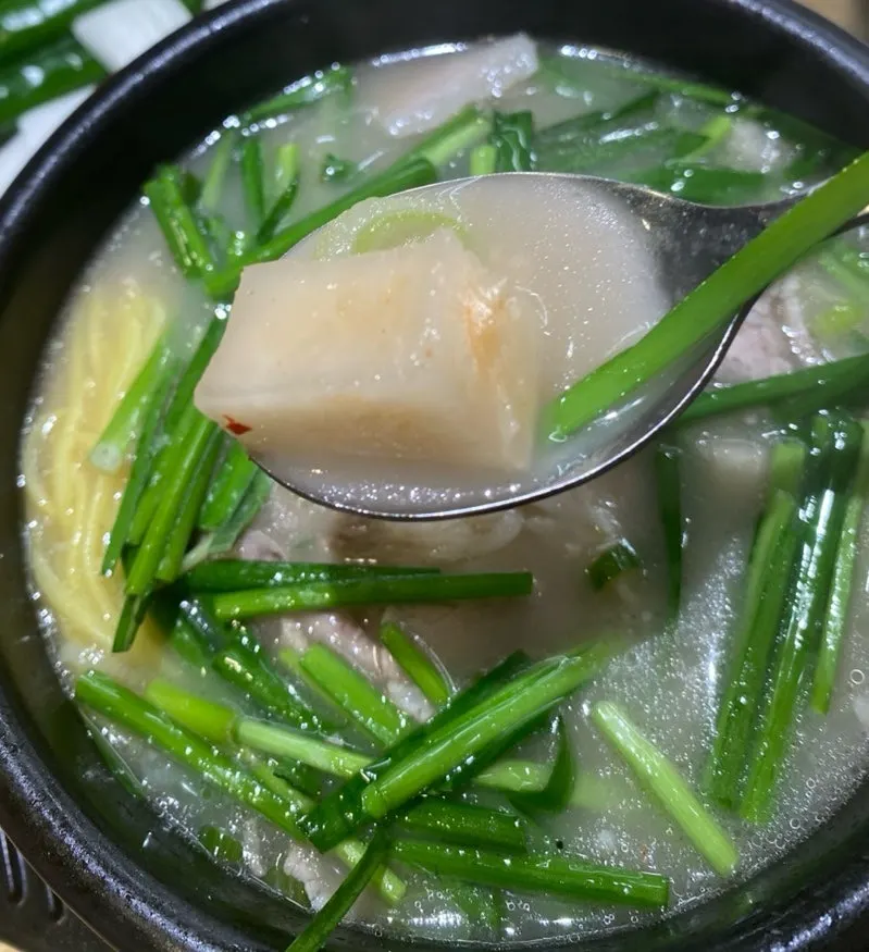 Radish kimchi dropped into the soup