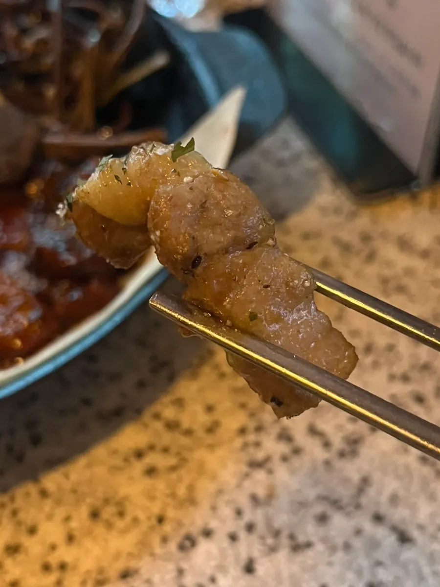 Aged pork belly eaten with the salad