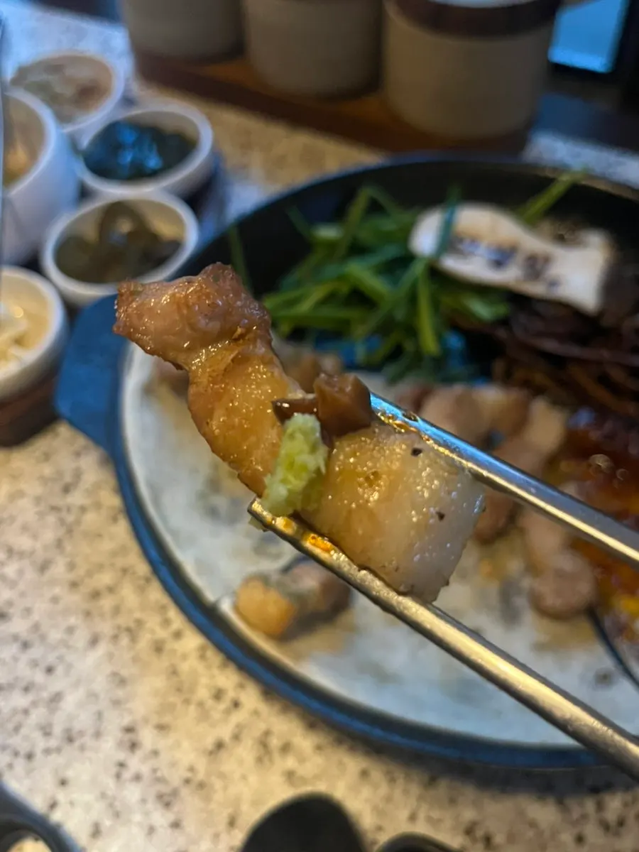Pork belly eaten with the shiitake wasabi combo