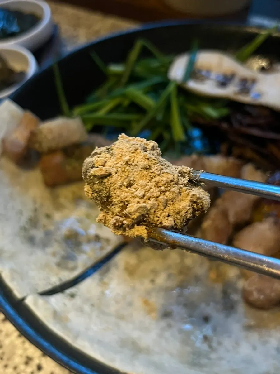 A piece of pork skin heavily coated in soybean powder
