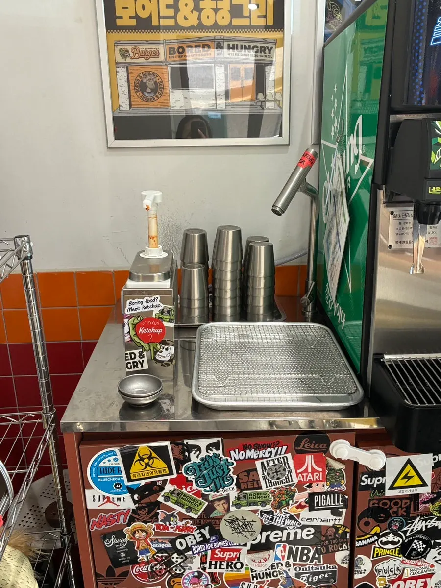 Plates, forks, and knives at the self-serve bar