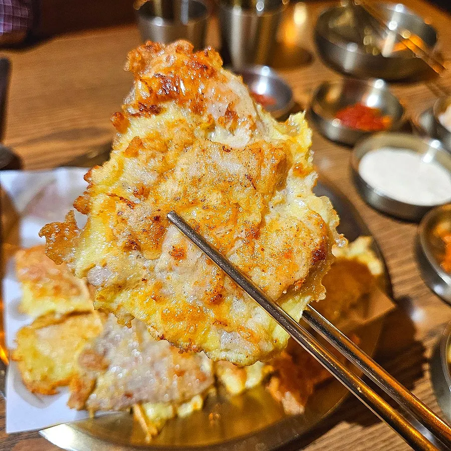 A plate of large assorted chicken jeon