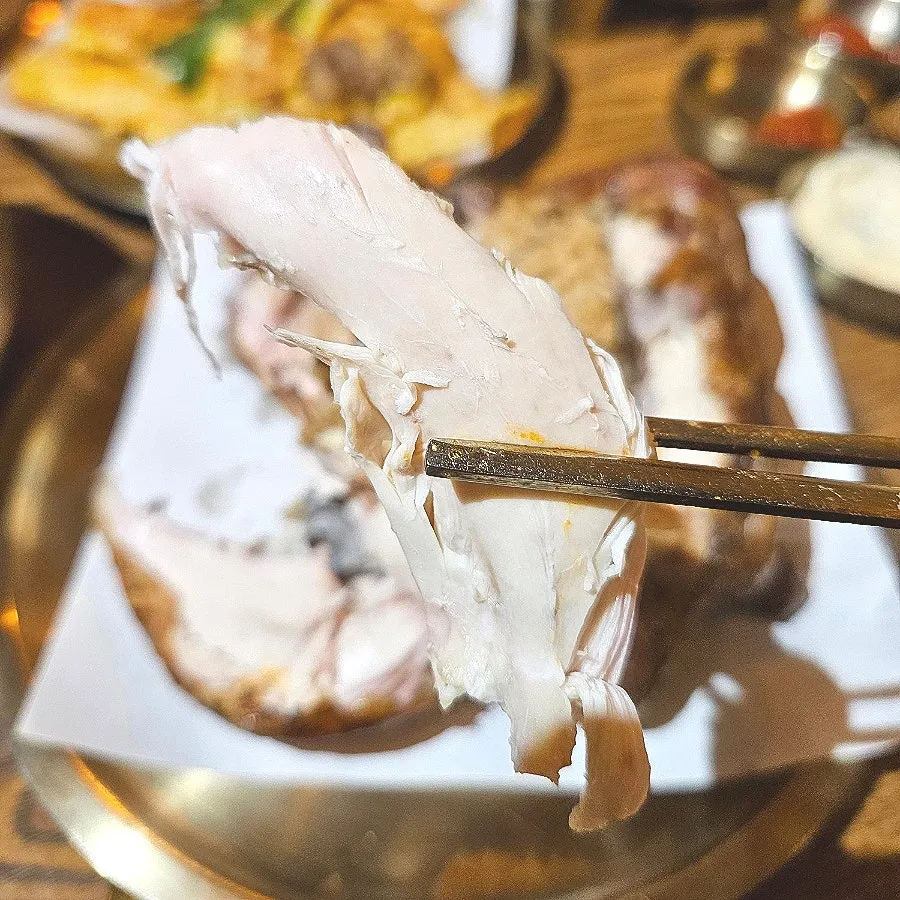 Glutinous rice and neungi mushrooms inside the fire-roasted chicken