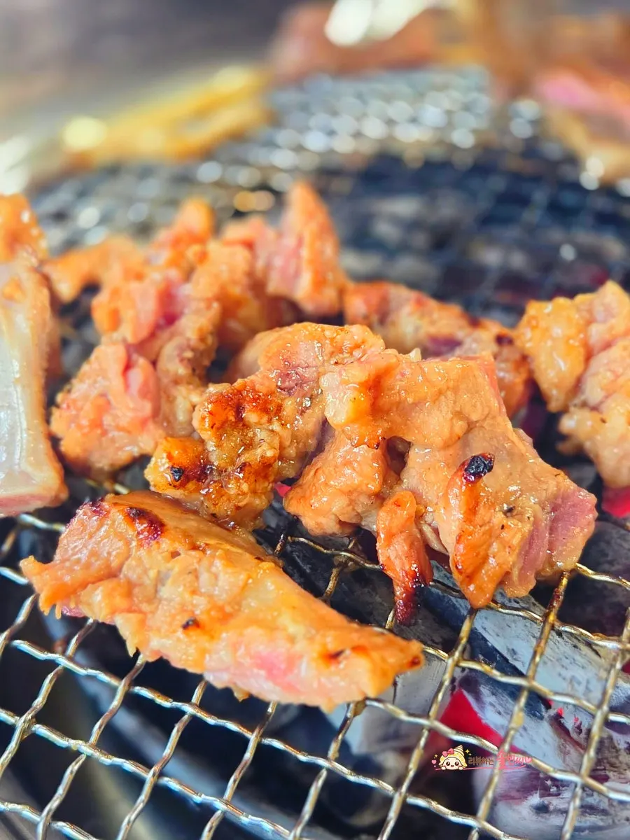 Pork galbi cooking on the grill