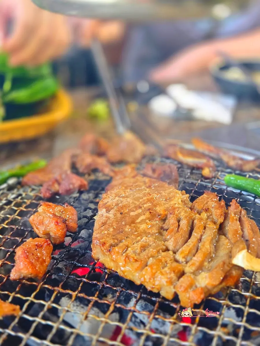 A piece of seasoned pork galbi served with vegetables