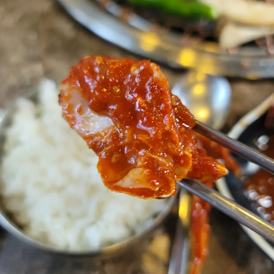 King oyster mushrooms and shishito peppers eaten with rice