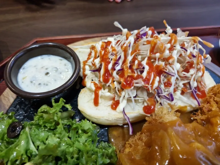 A piece of homemade chicken cutlet with sauce