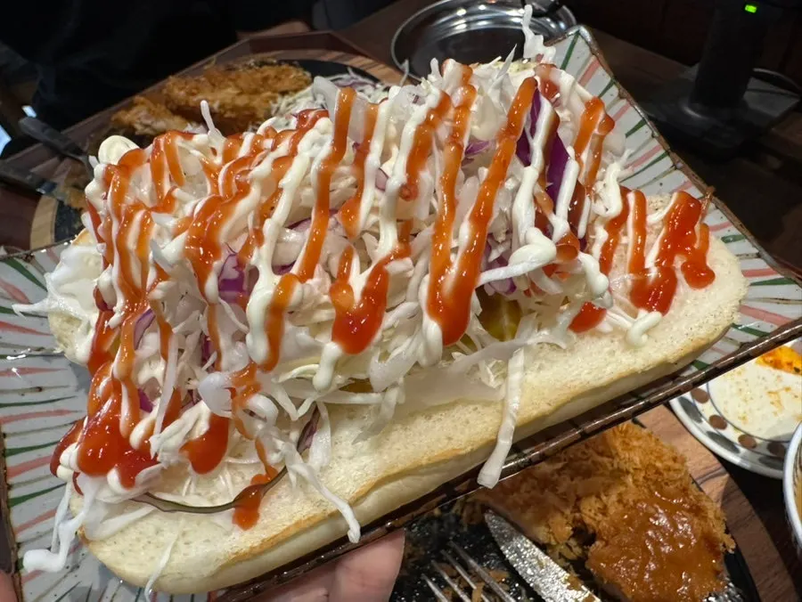Fried chicken steak served with spicy sauce