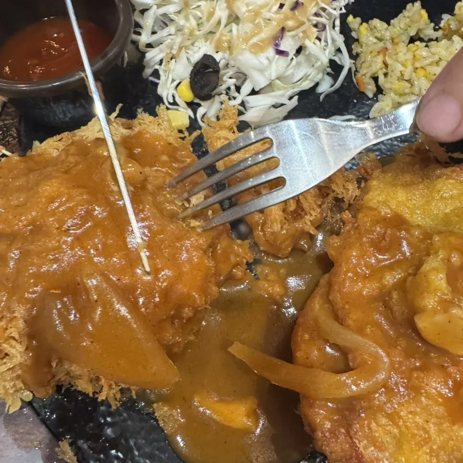 Table setting with egg fried rice and cutlets