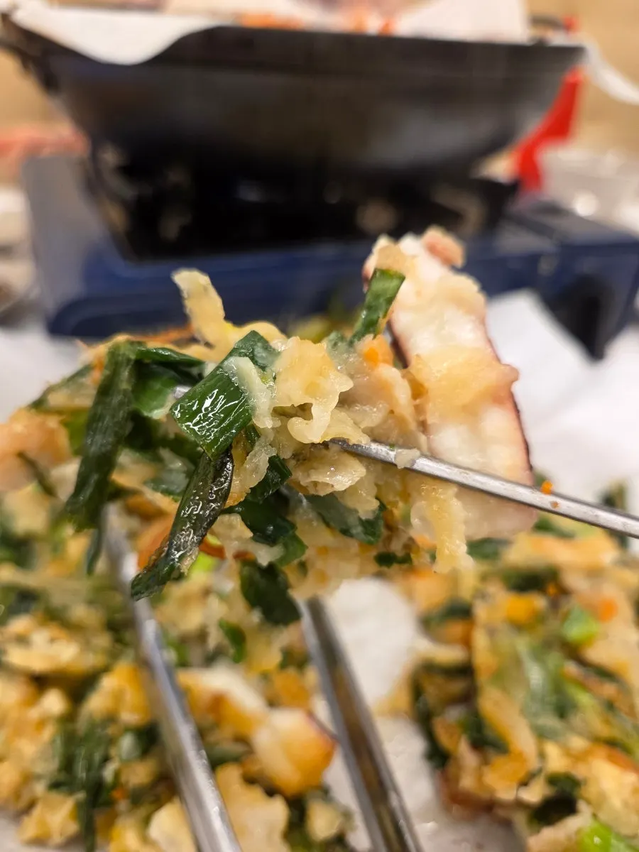 Cross-section of the seafood pancake showing the seafood filling