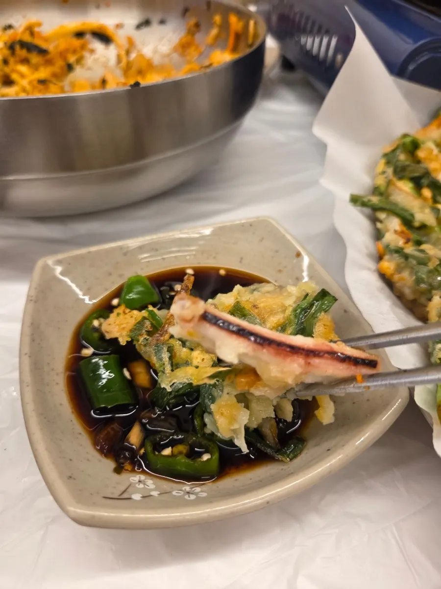Seafood pancake dipped in soy sauce