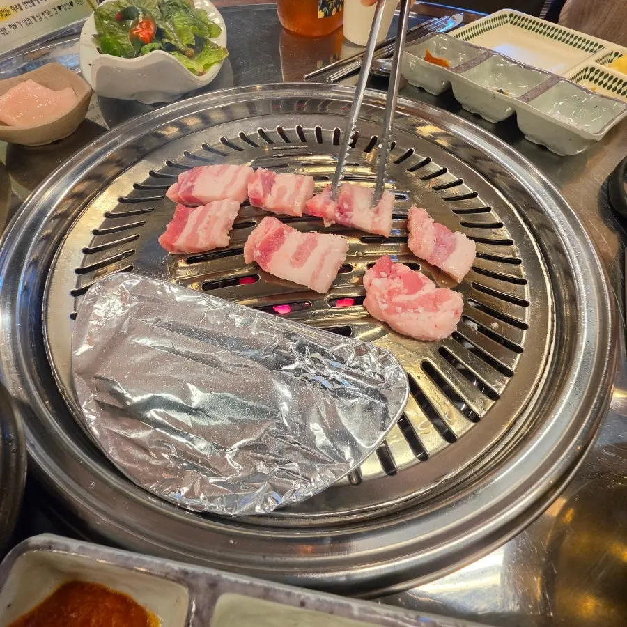Pork belly grilling until crisp
