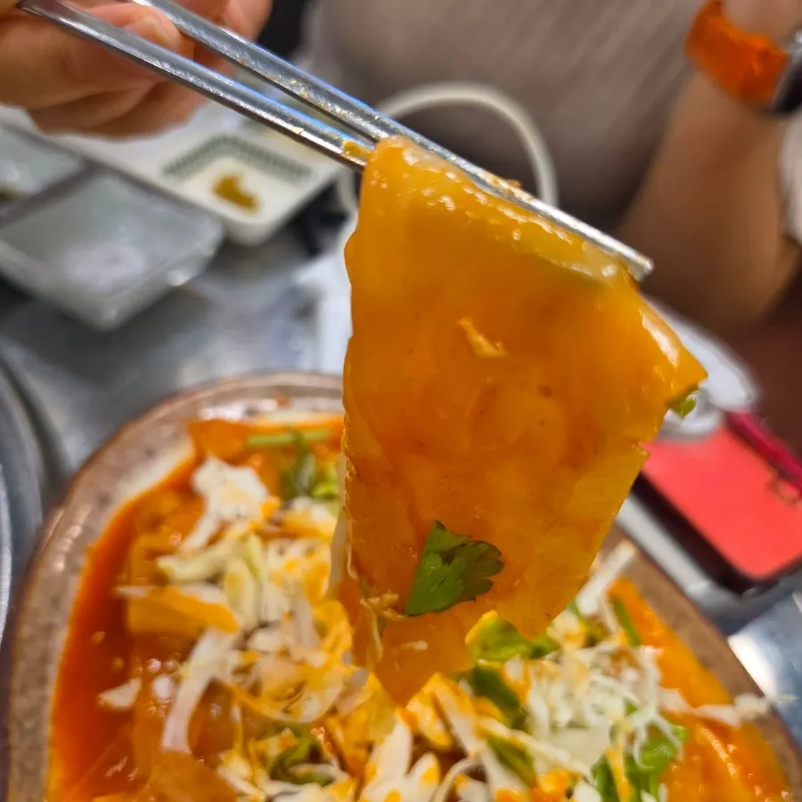 Original flat spicy noodles eaten with meat