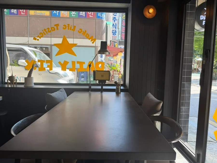 Interior of Daily Fix with black finish and yellow tables