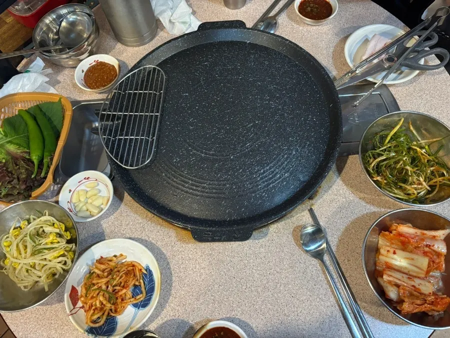 Two servings of thinly sliced daepae samgyeopsal at Gyodaepae