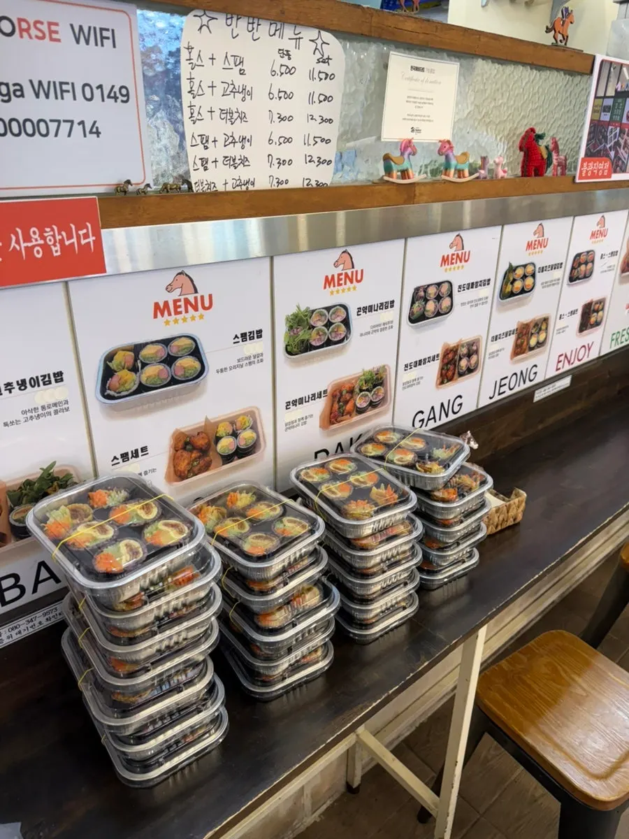 Takeout and delivery orders moving through the shop