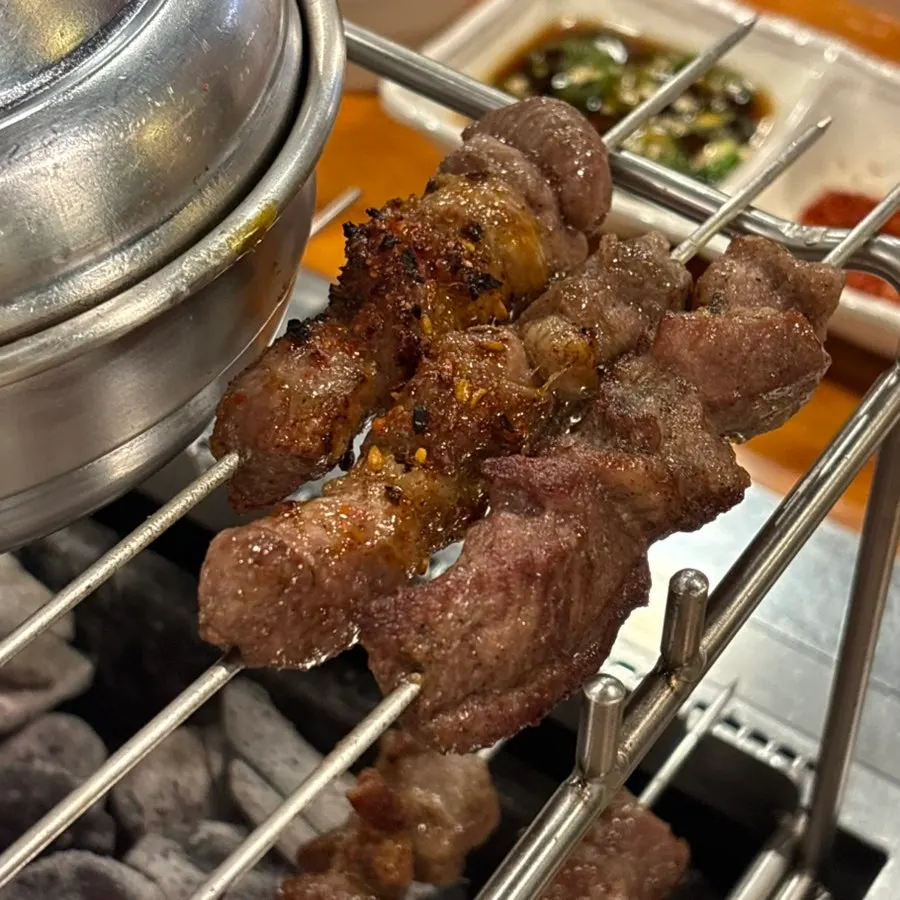 Thick, glossy lamb skewers