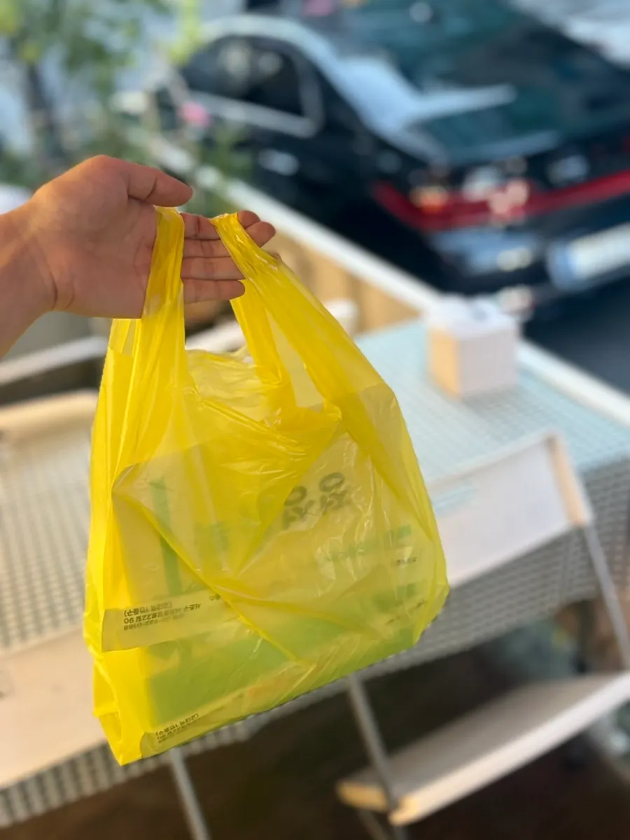 Takeout bag of Halls Gimbap dakgangjeong