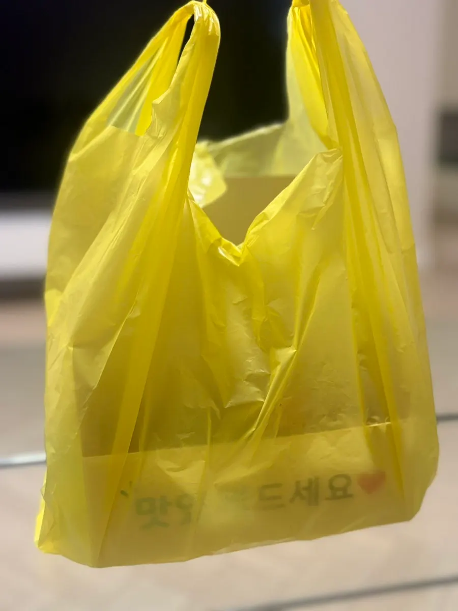 Dakgangjeong takeout container opened at home