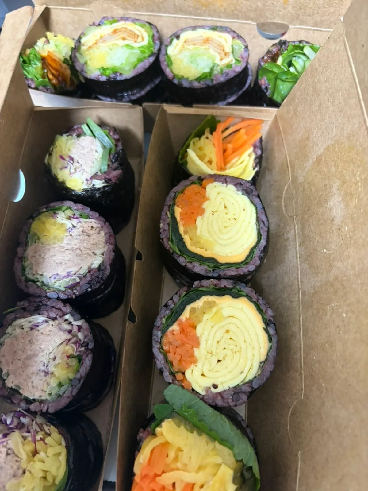 Table spread of three types of takeout gimbap