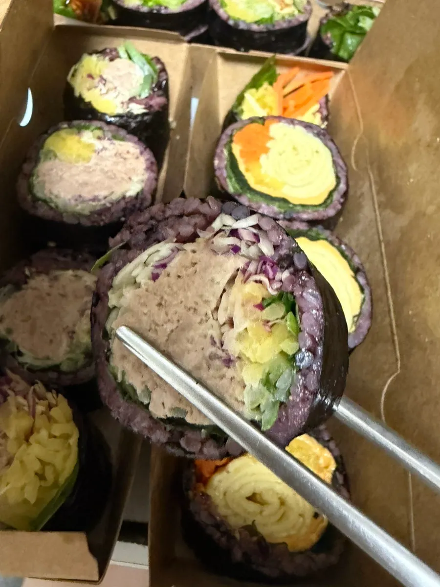 A packaged roll of wasabi gimbap