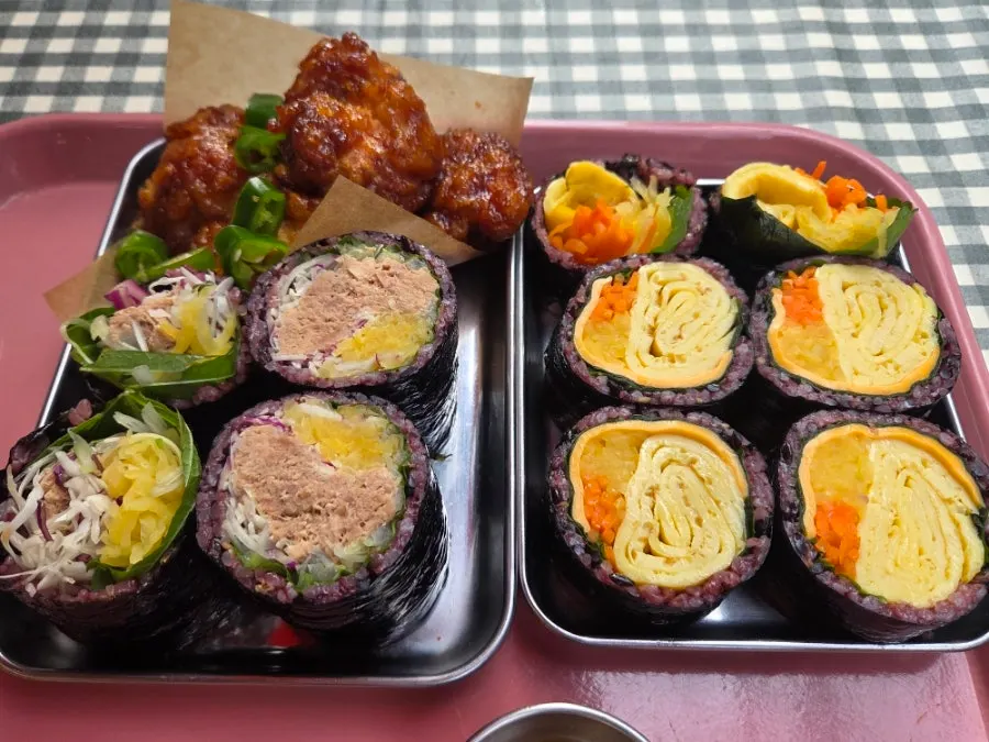 Table with double-cheese egg gimbap and dakgangjeong
