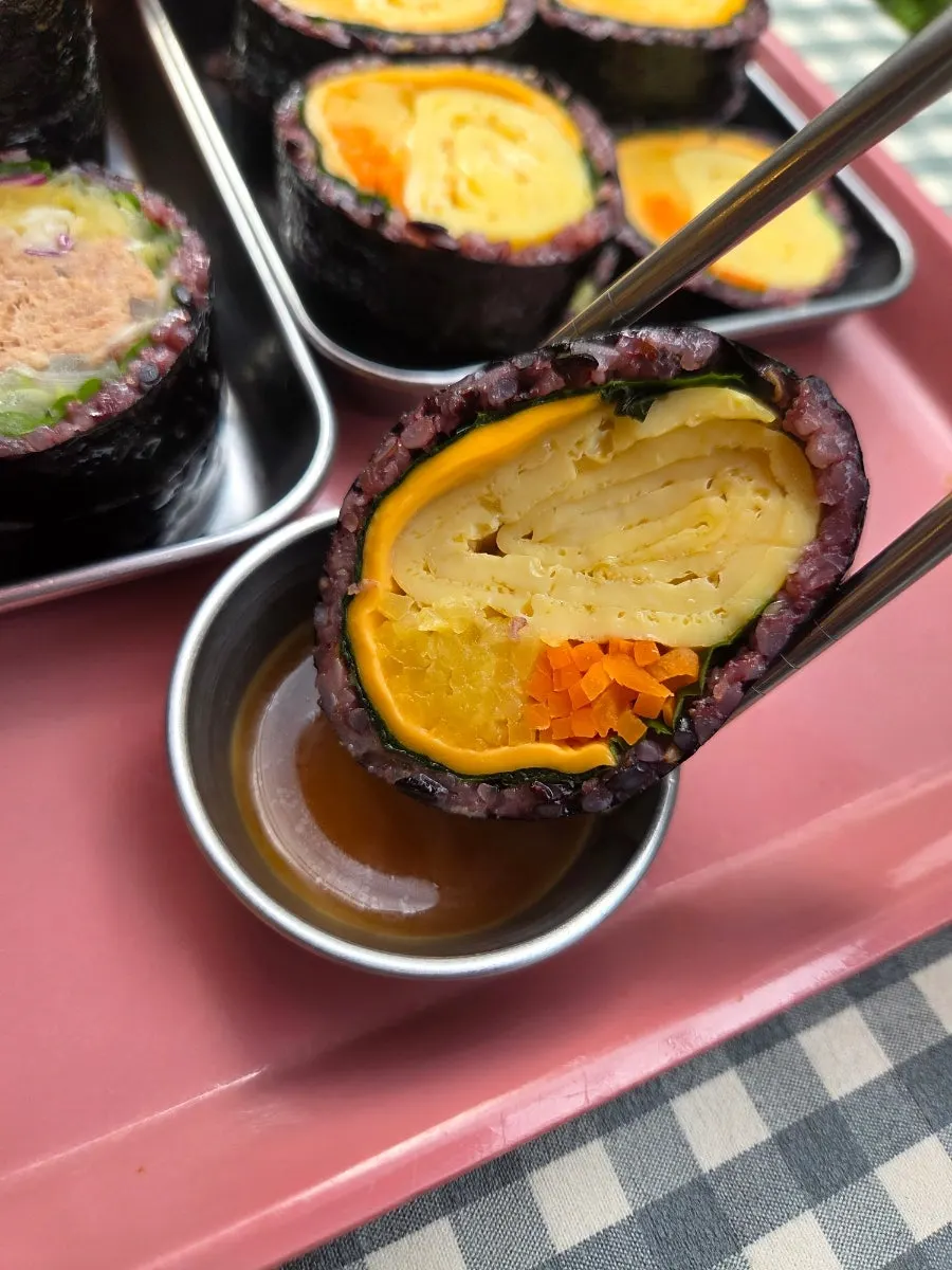 Double-cheese egg gimbap served with dipping sauce