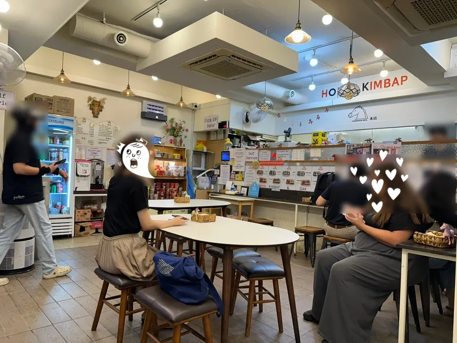 Tables inside the Halls Gimbap Main Branch dining hall