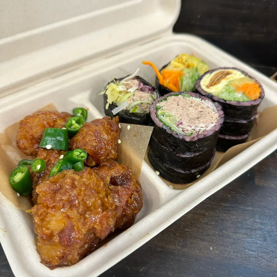 Half fried chicken, half gimbap set composition