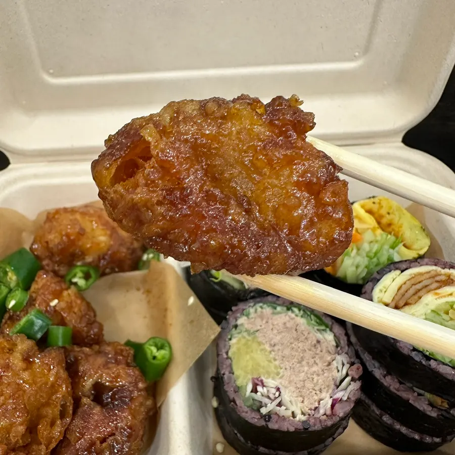 Fried chicken topped with hot green peppers