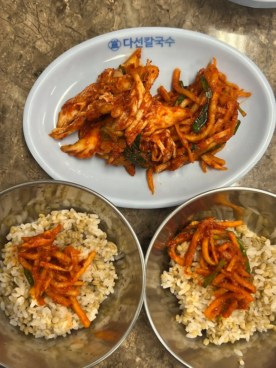 Kalguksu noodles enjoyed with accompaniments