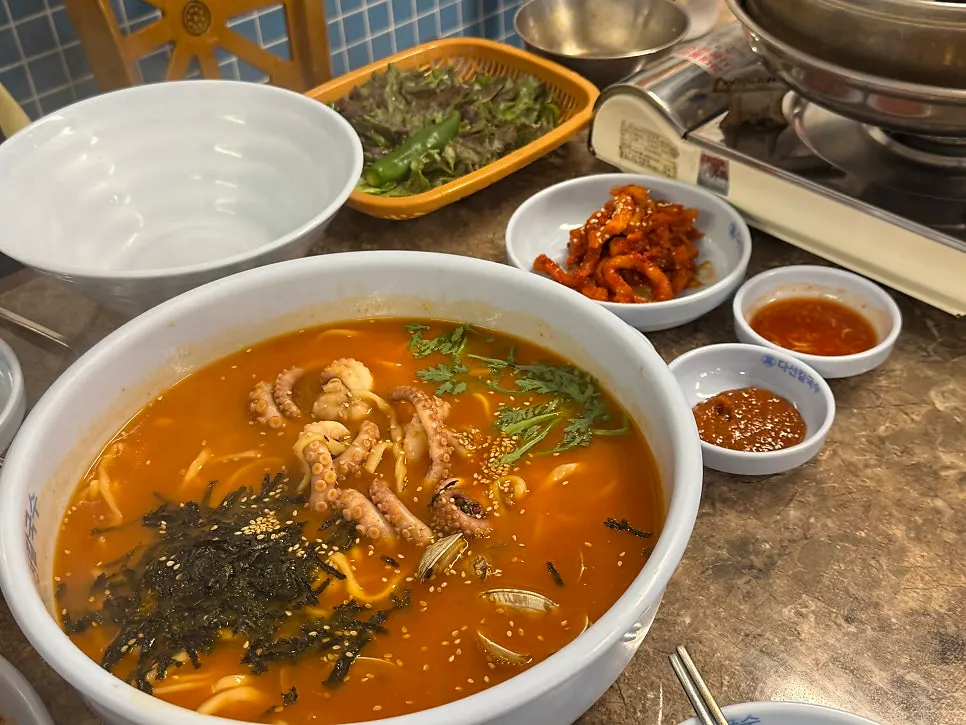 A Gyodae Station meal of spicy octopus kalguksu and boiled pork bossam