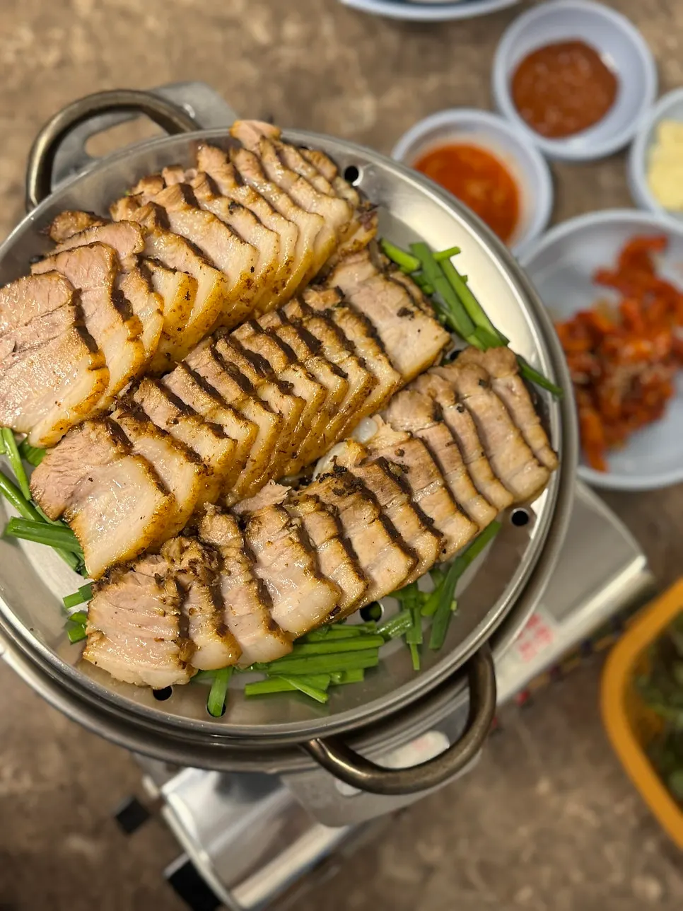 Boiled pork with bossam kimchi and accompaniments