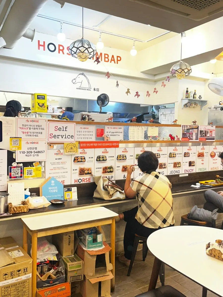 Interior of Halls Gimbap Main Branch with tables