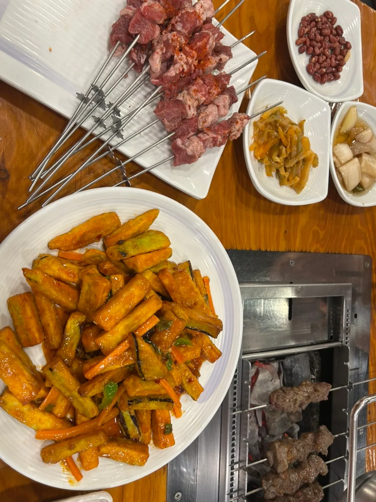 Basic side dishes of peanuts, pickled onions, and pickled radish