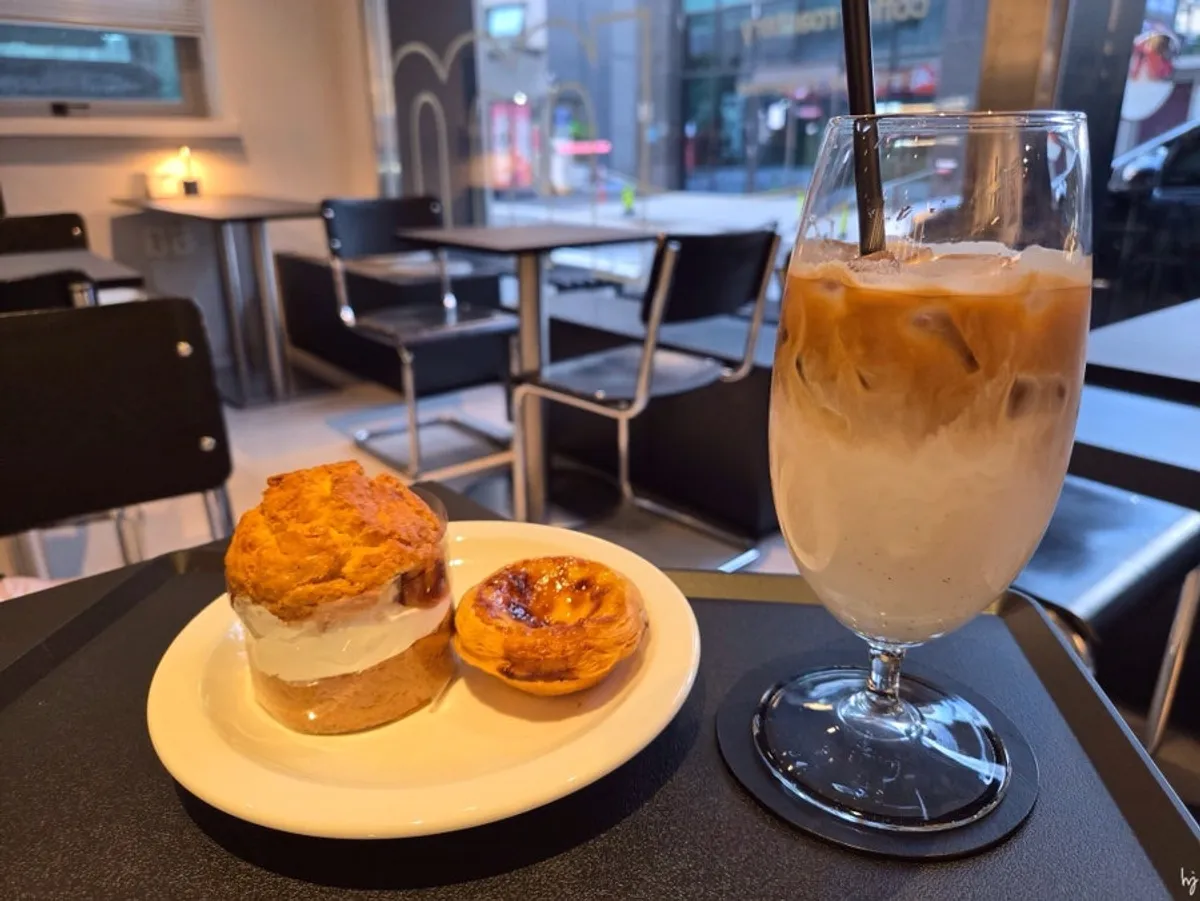 Helsinki Latte, Victoria Scone, and egg tart laid out together
