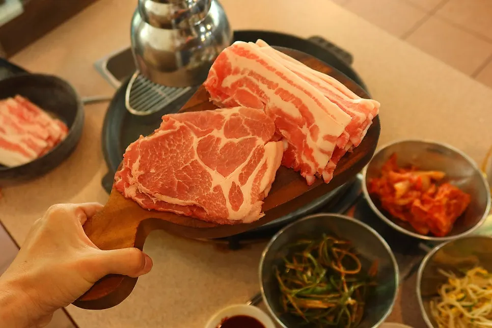 Frozen thin-sliced pork belly on the grill