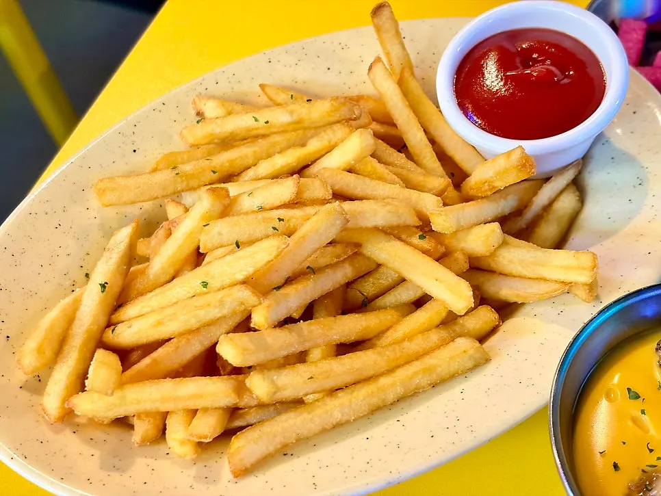 Bacon cheese fries served with sauce