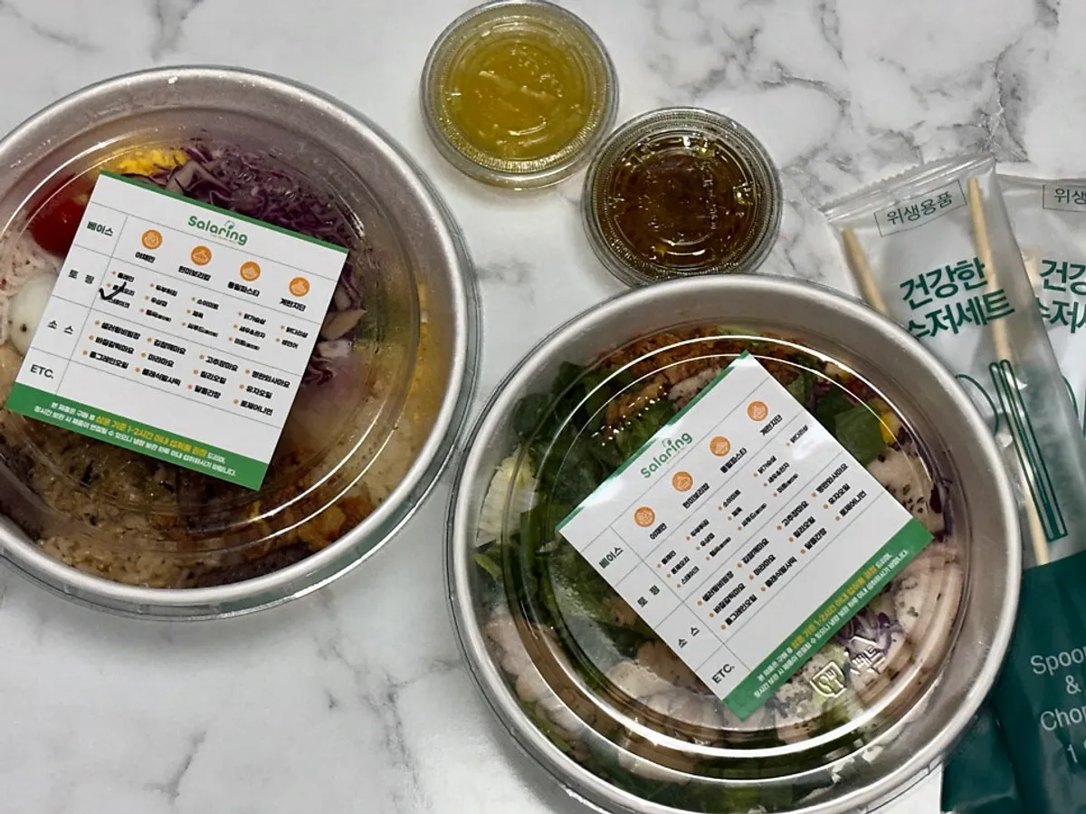 Two takeaway bibim poke salads