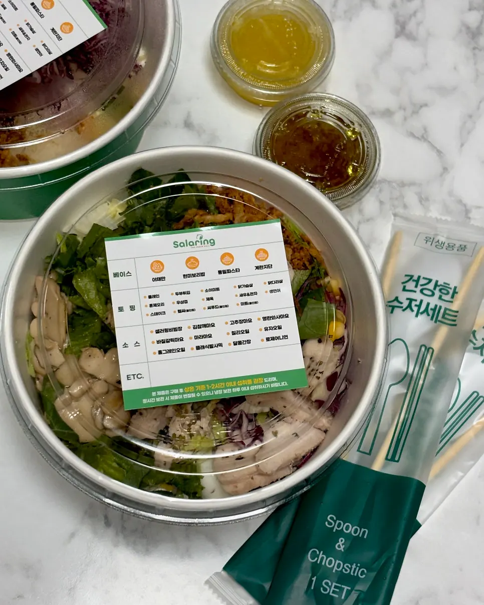 Poke takeaway with sauce and a cutlery set