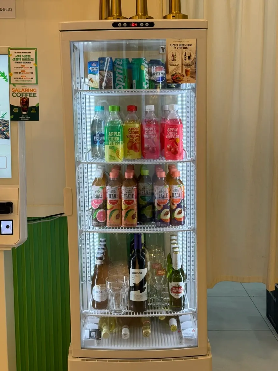 Refrigerated display of drinks and beer at Salering Gyodae Direct Store